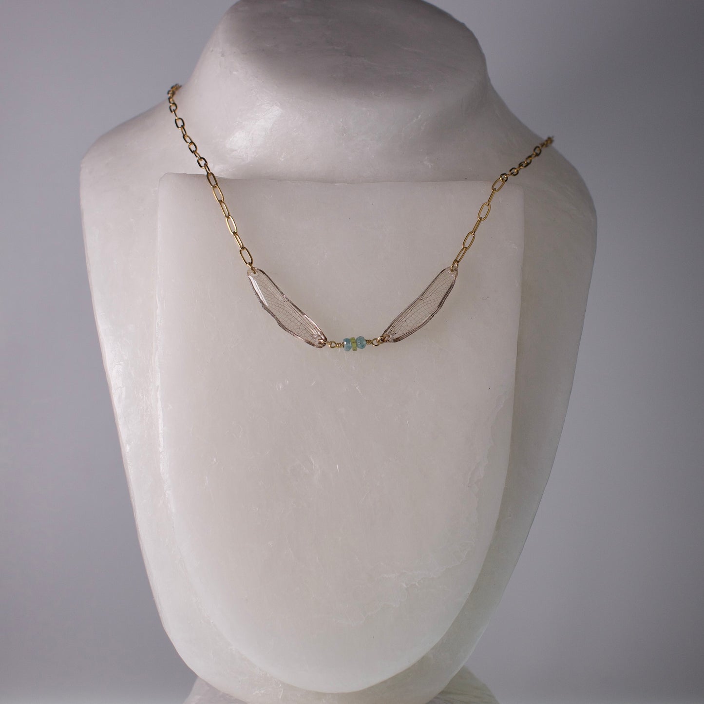 real dragonfly wing necklace blue green gold paperclip chain on wax form