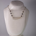 real dragonfly wing necklace iridescent pearls silver chain on wax from grey background