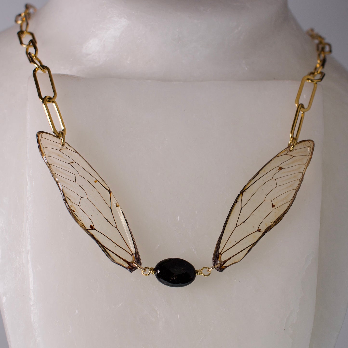 real giant cicada wing necklace gold sheen obsidian gold paperclip chain necklace on mannequin