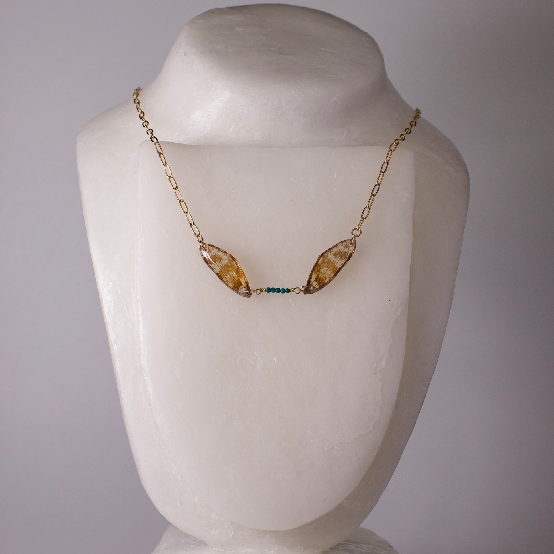 real leaf hopper necklace Northwestern Leafhopper turquoise gold necklace on mannequin