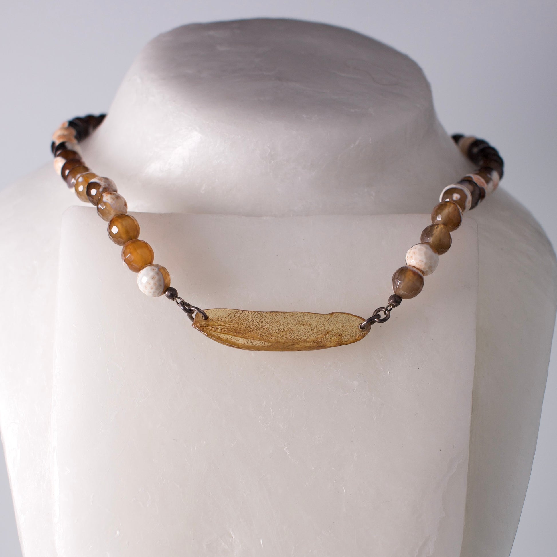 real praying mantis wing pendant sterling silver faceted agate strand necklace on mannequin