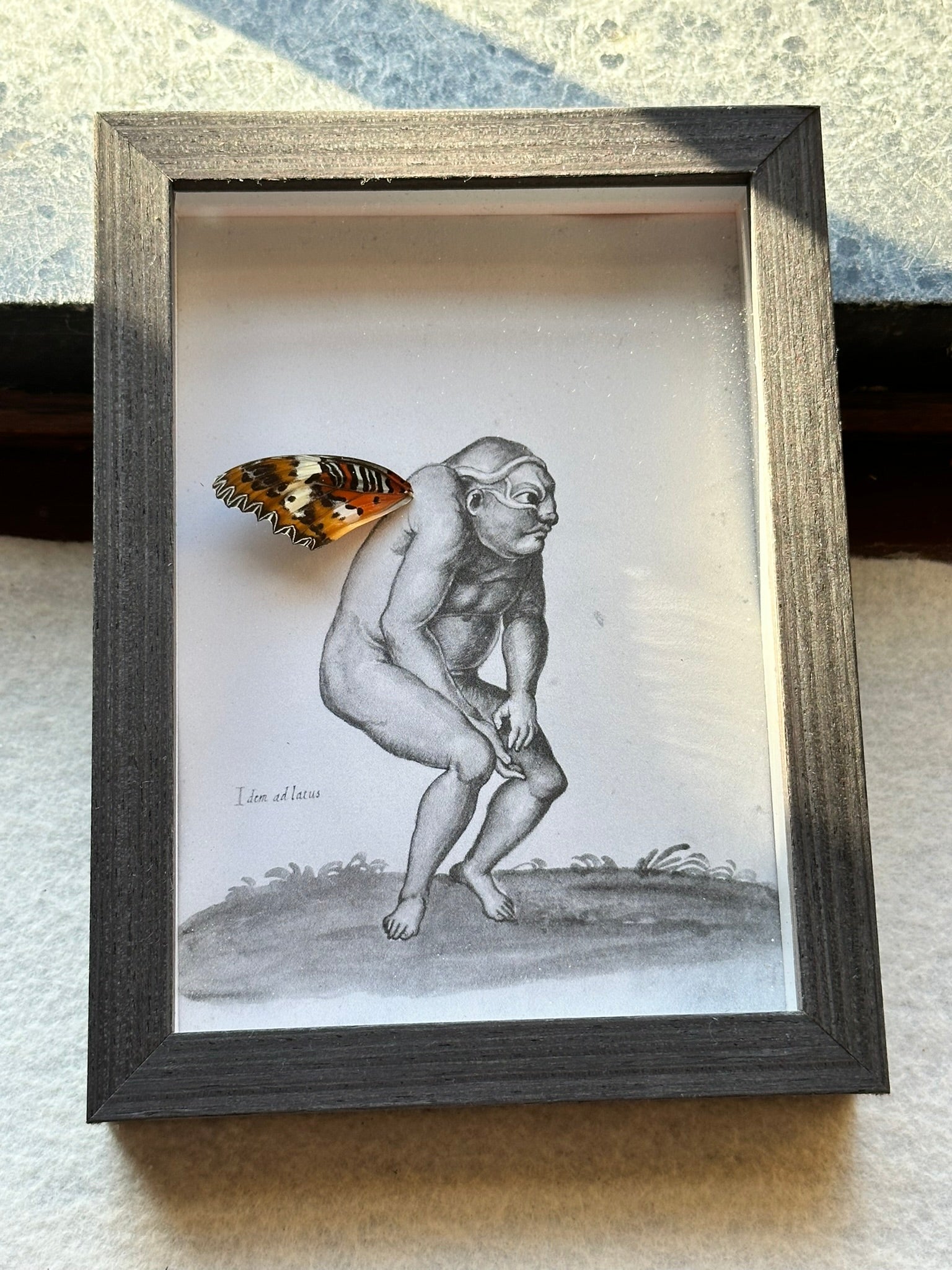 a drawing of a naked man with a butterfly on it